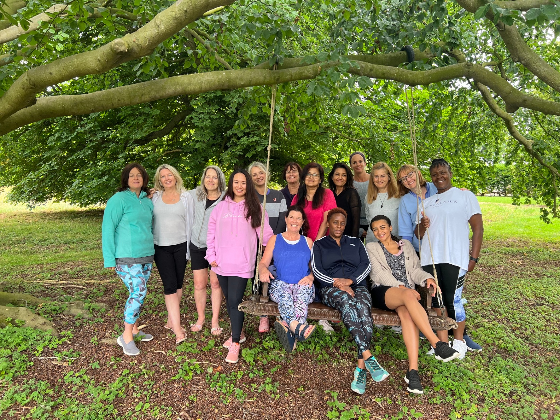 A previous group of women retreatants beneath the ancient trees