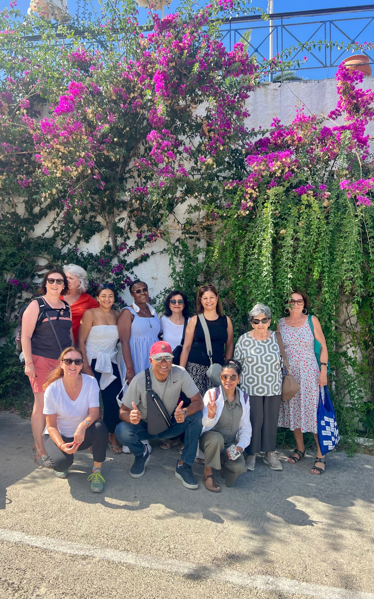 Ikaria retreat group in front of bougainvillea
