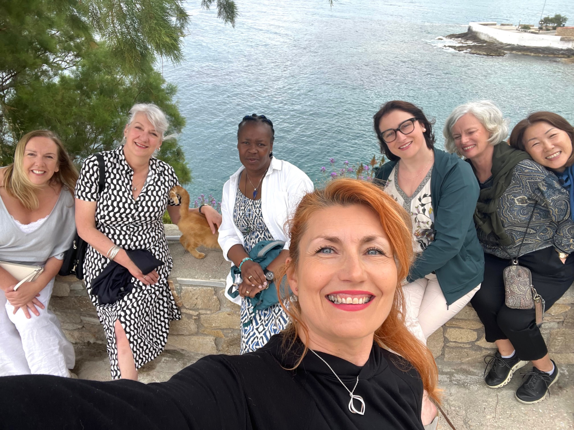 Ikaria 2025 retreat group at sunset by the pool