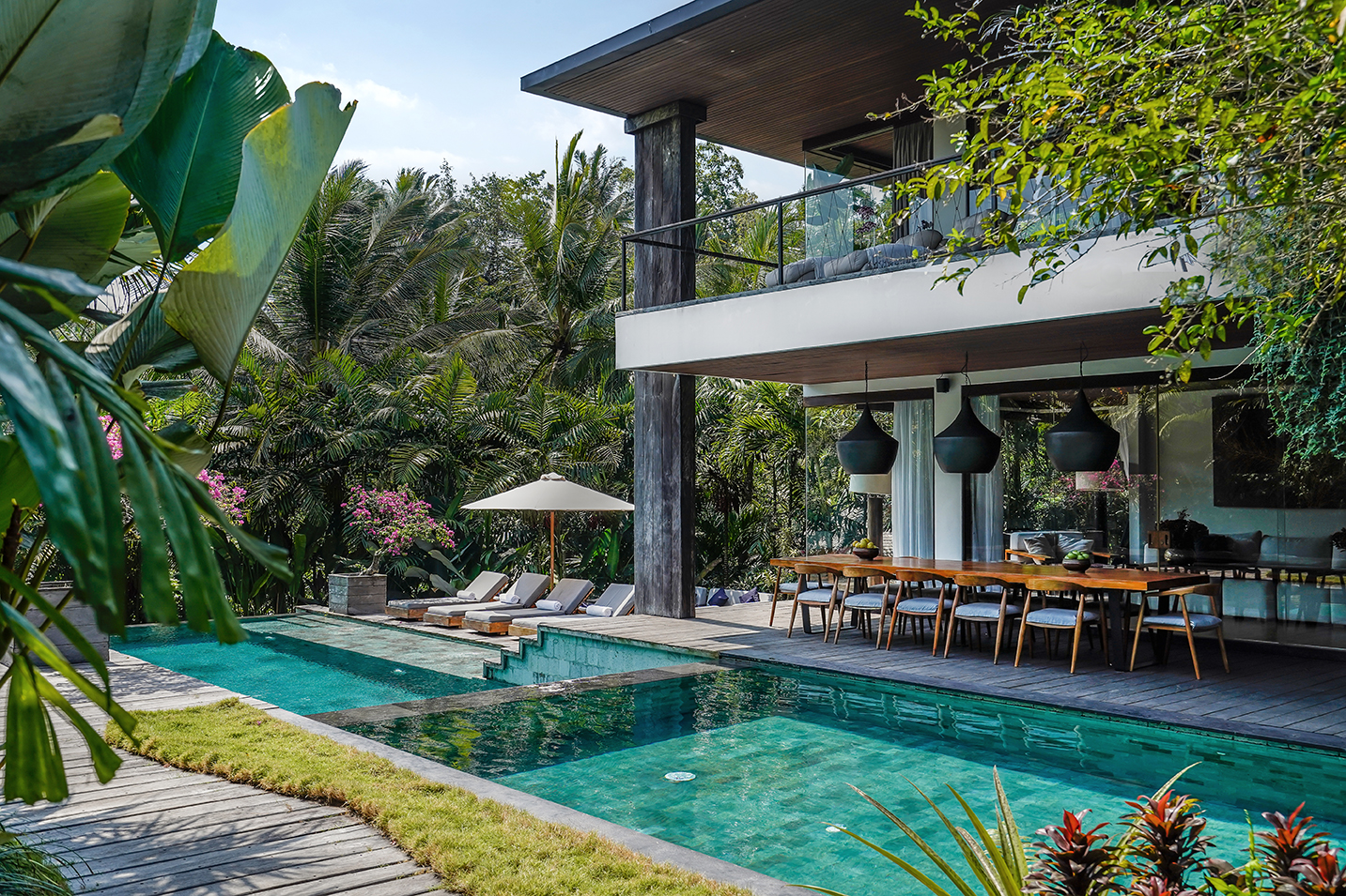Dwa Chandra villa in Bali — pool, dining terrace and ancient jungle