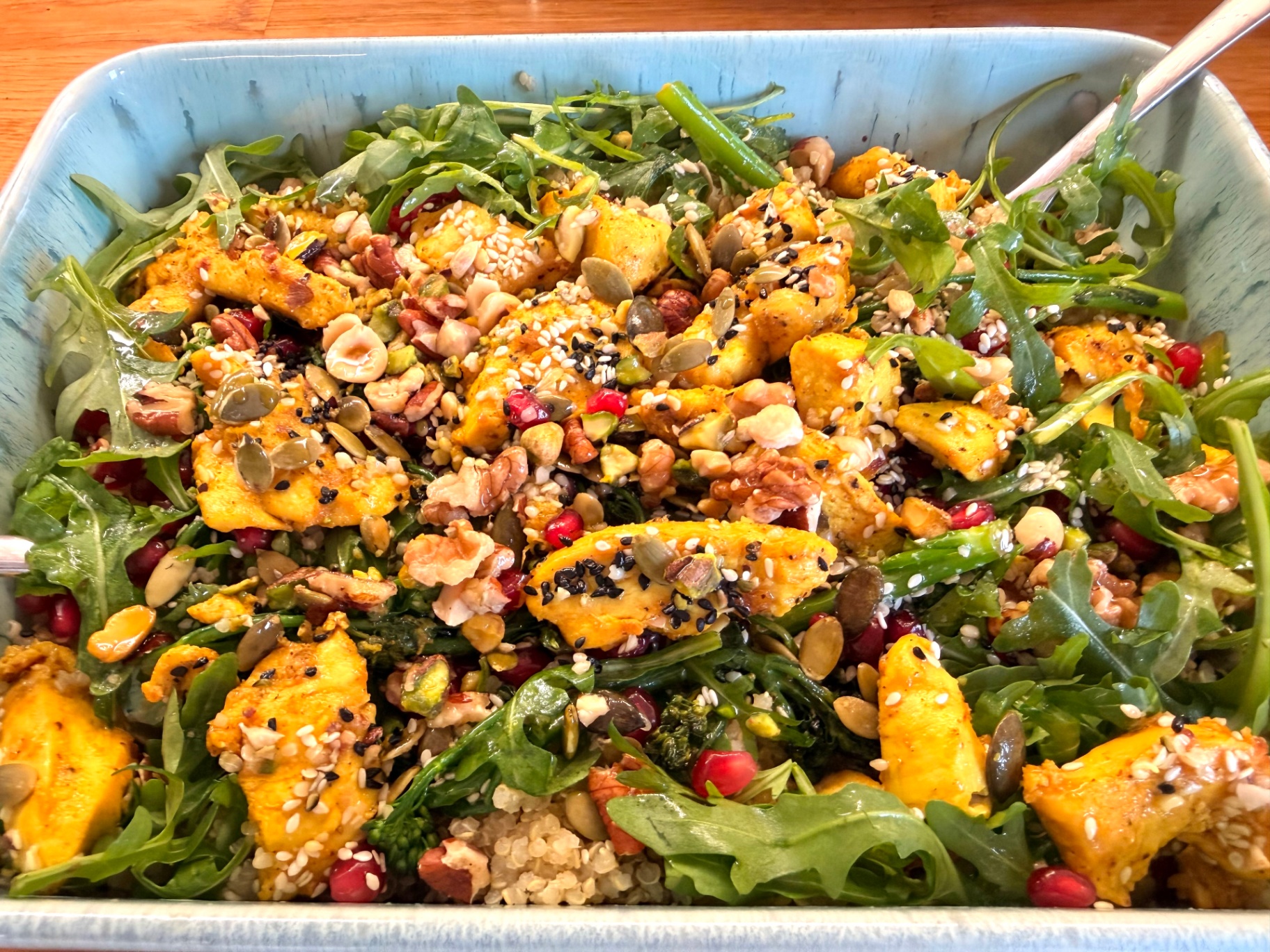 Nourishing gut-brain lunch — quinoa, greens, roasted squash, seeds and pomegranate