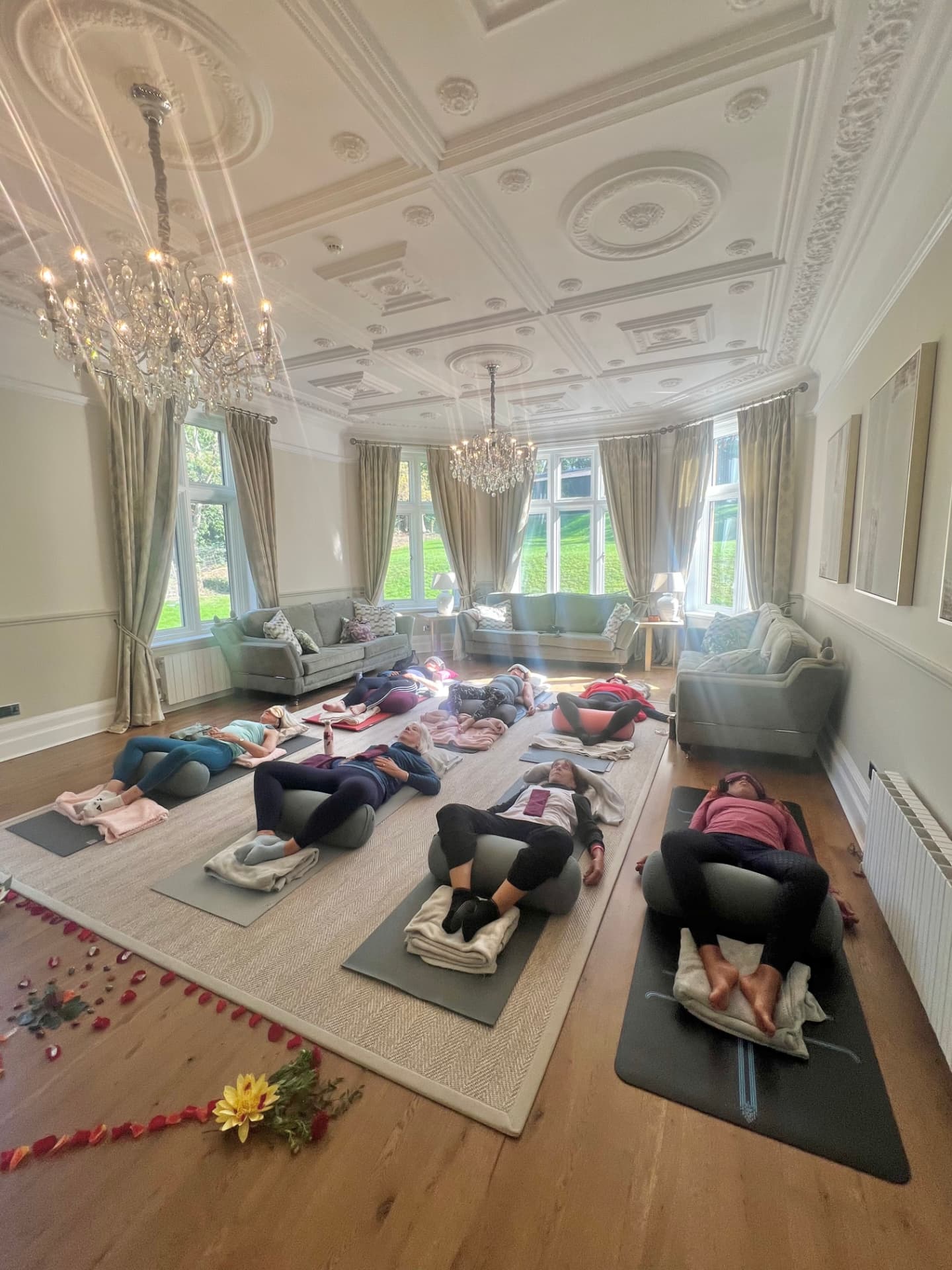 Restorative practice in the chandeliered ballroom at The Grange