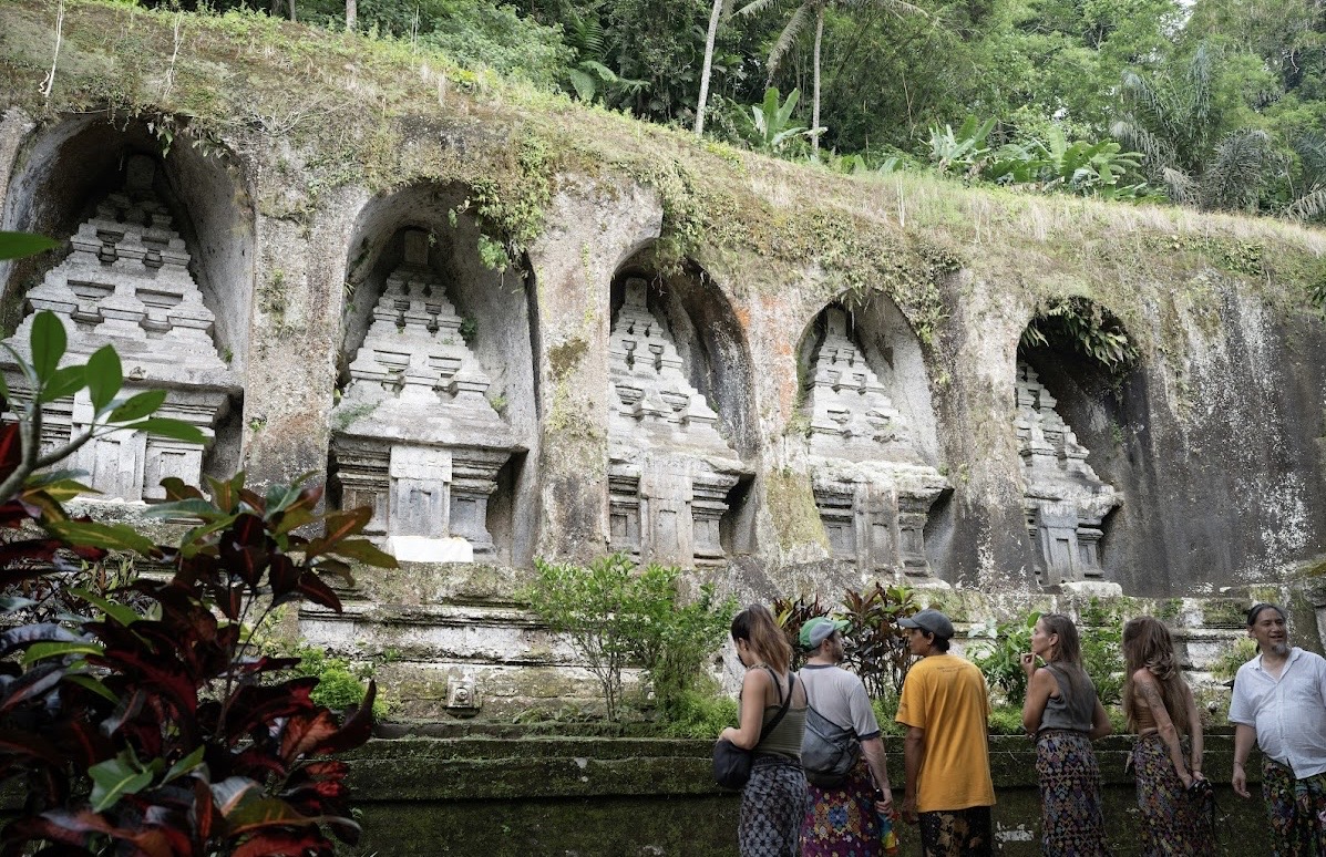 Retreat group visiting ancient temple carvings in Gianyar, Bali